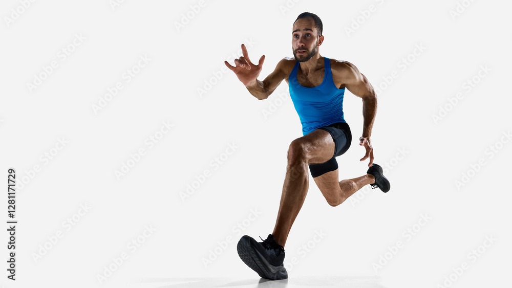 Fototapeta premium Focused man, runner athlete with muscular body in motion, training isolated on white studio background. Concept of sport, competition, endurance, athletics, sportive lifestyle. Copy space