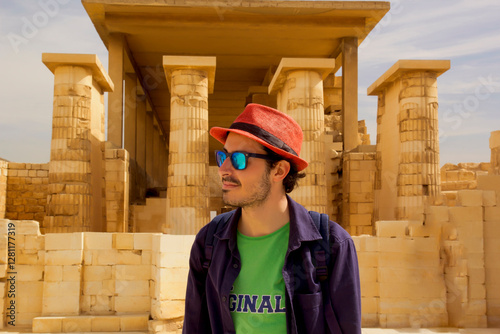 potrait of handsome man in sunglasses and red hat in Sakkara , Cairo Egypt	
