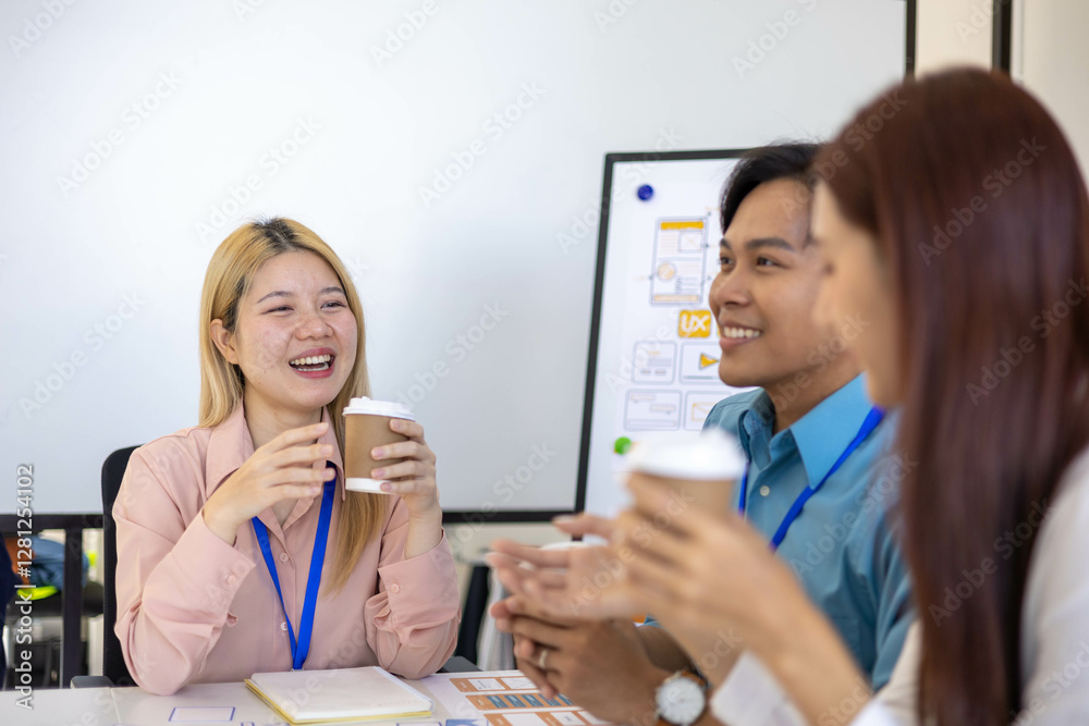 Three people are sitting around a table, working on a project. They are wearing name tags and are pointing at a whiteboard. Scene is collaborative and focused
Three people are sitting around a table, working on a project. They are wearing name tags and are pointing at a whiteboard. Scene is collaborative and focused