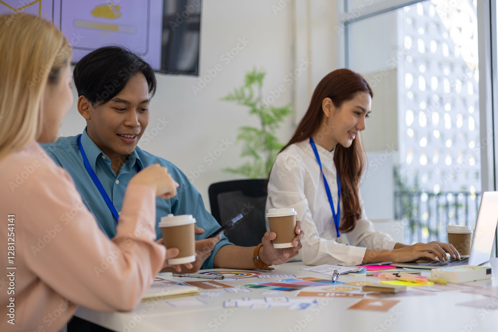 Three people are sitting around a table, working on a project. They are wearing name tags and are pointing at a whiteboard. Scene is collaborative and focused
Three people are sitting around a table, working on a project. They are wearing name tags and are pointing at a whiteboard. Scene is collaborative and focused