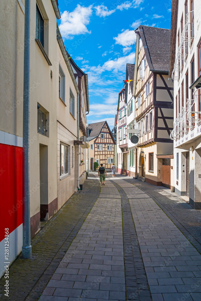 old town of Linz am Rhein with unidentified people. The town is a popular tourist destination because of its colorful half-timbered houses