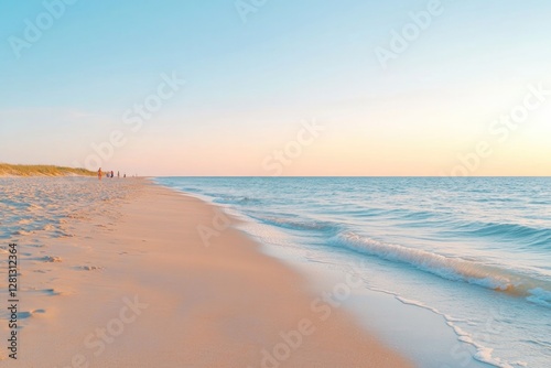 golden hour on serene beach with calm waves and soft sand underfoot