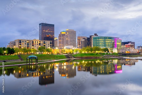 Dayton, Ohio, USA downtown cityscape on the Miami River at dusk. photo