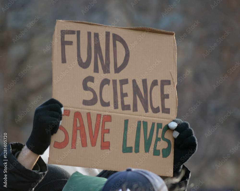 Sign at protest against government funding cuts to scientific research in New York City.