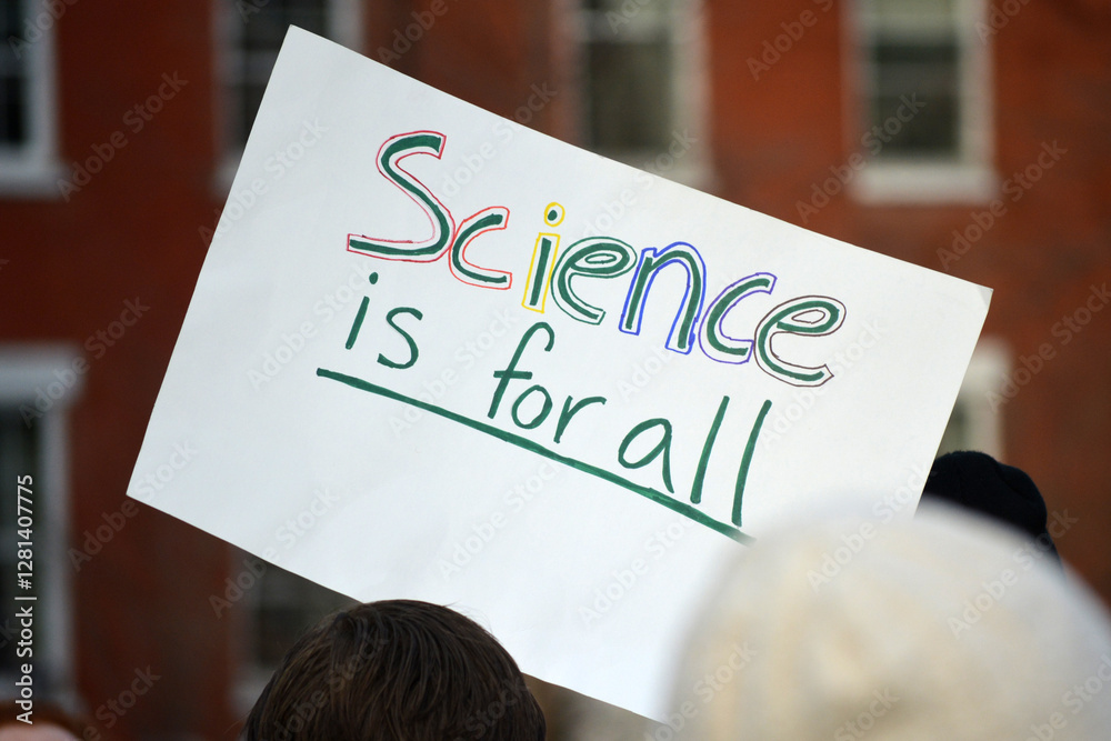 Sign at protest against government funding cuts to scientific research in New York City.