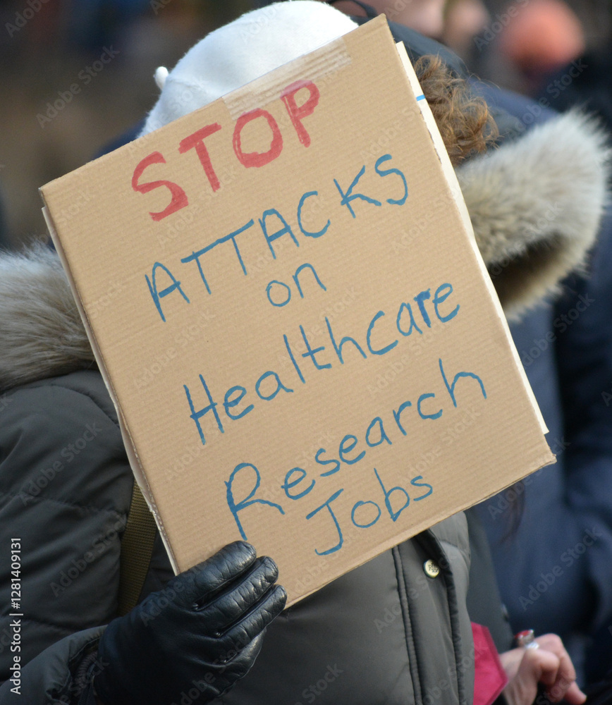 Sign at protest against government funding cuts to scientific research in New York City.