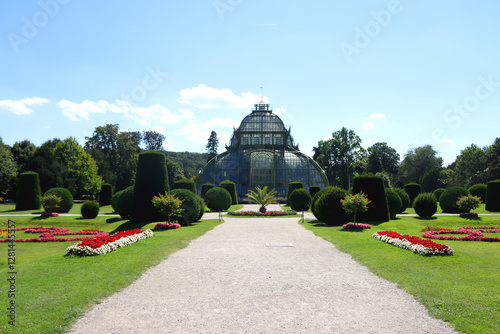 Historical greenhouse and beautiful garden in Schönbrunn Park, in Vienna, Austria. Historical landmark in Vienna. photo