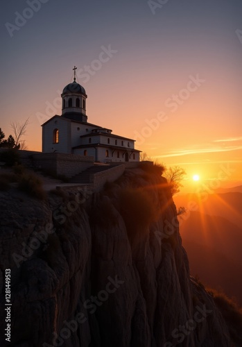 Perched on the edge of a cliff, a majestic church is illuminated by the vibrant colors of sunset, reflecting spiritual beauty amid dramatic landscapes.