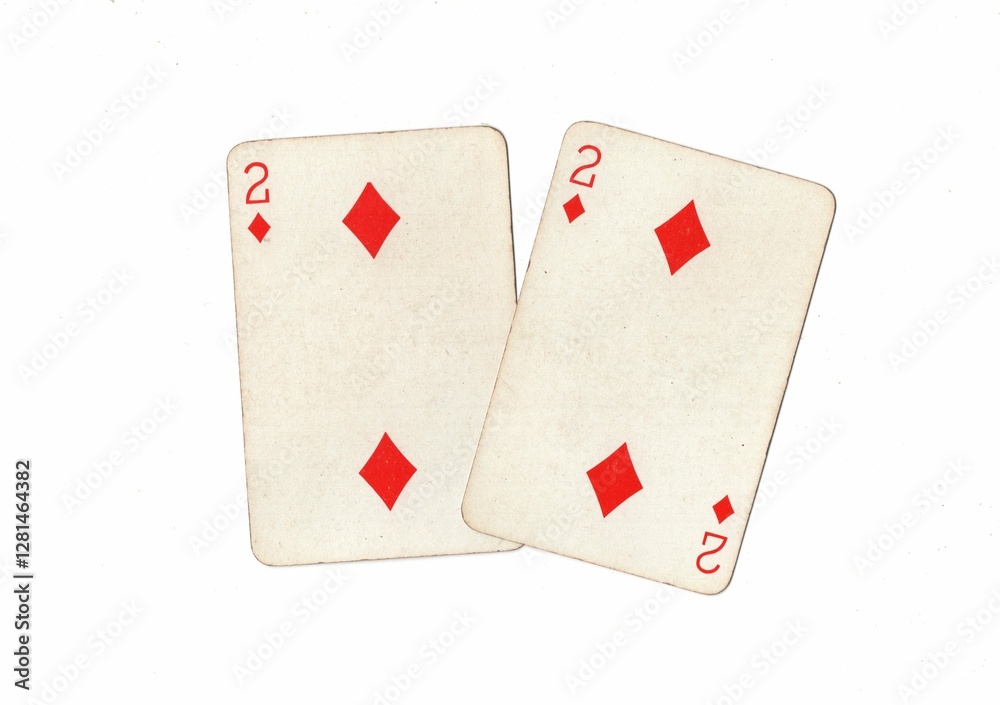 Obraz premium A pair of identical vintage playing cards on a white background.