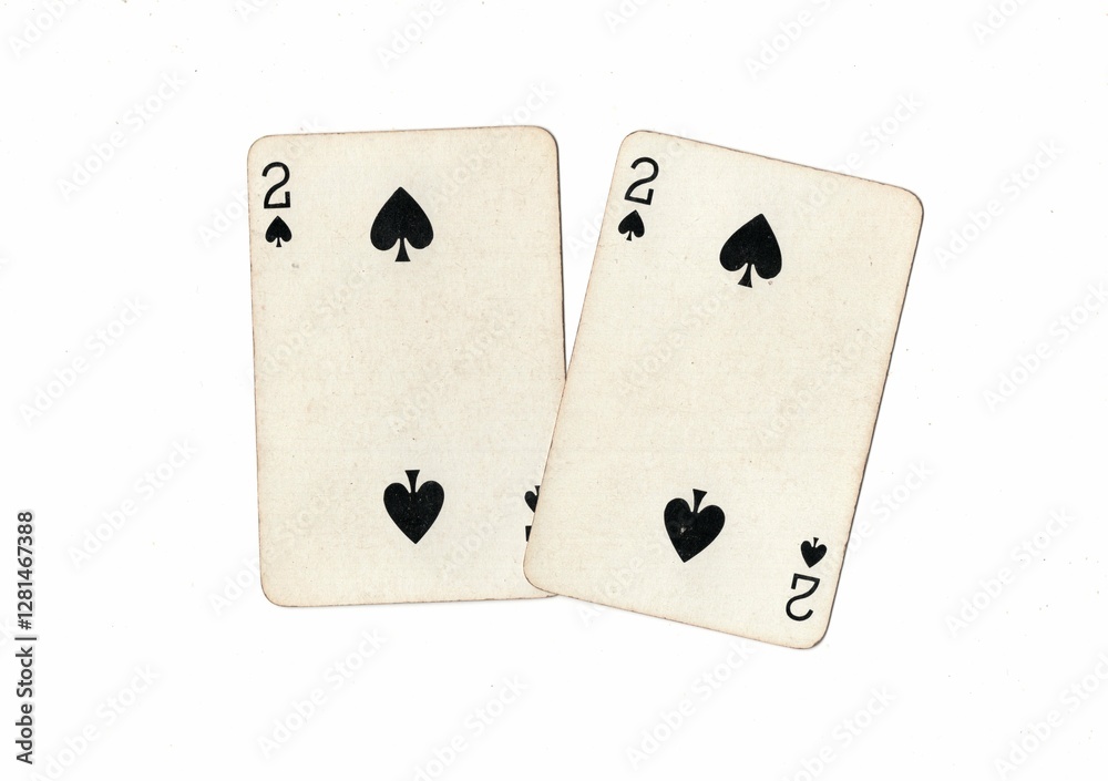 Obraz premium A pair of identical vintage playing cards on a white background.