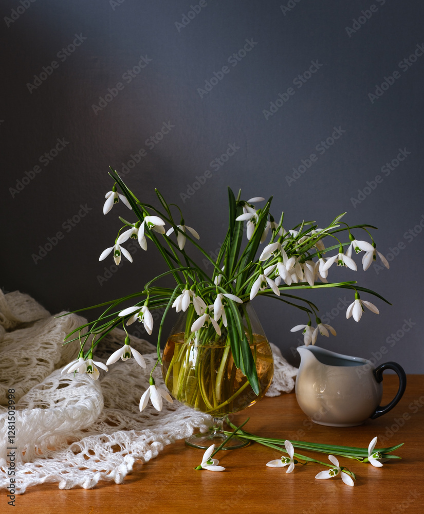 A Beautiful Arrangement of Elegant Snowdrops in a Glass Vase