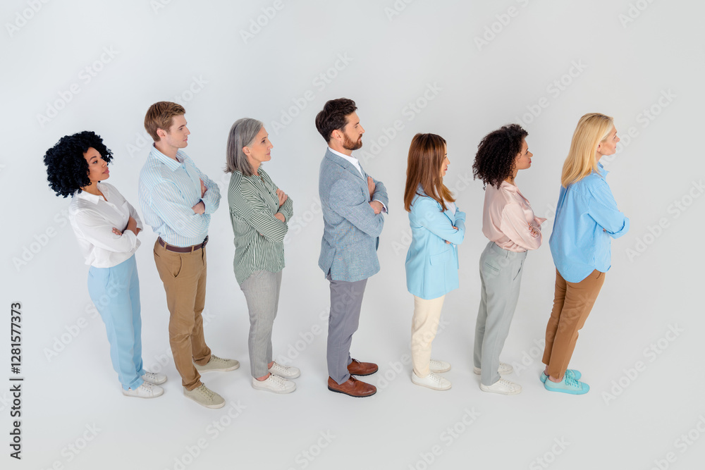 Diverse group of professionals standing in a line on a grey background, showcasing unity and teamwork in a corporate environment, top view Diverse group of professionals standing in a line on a grey background, showcasing unity and teamwork in a corporate environment, top view