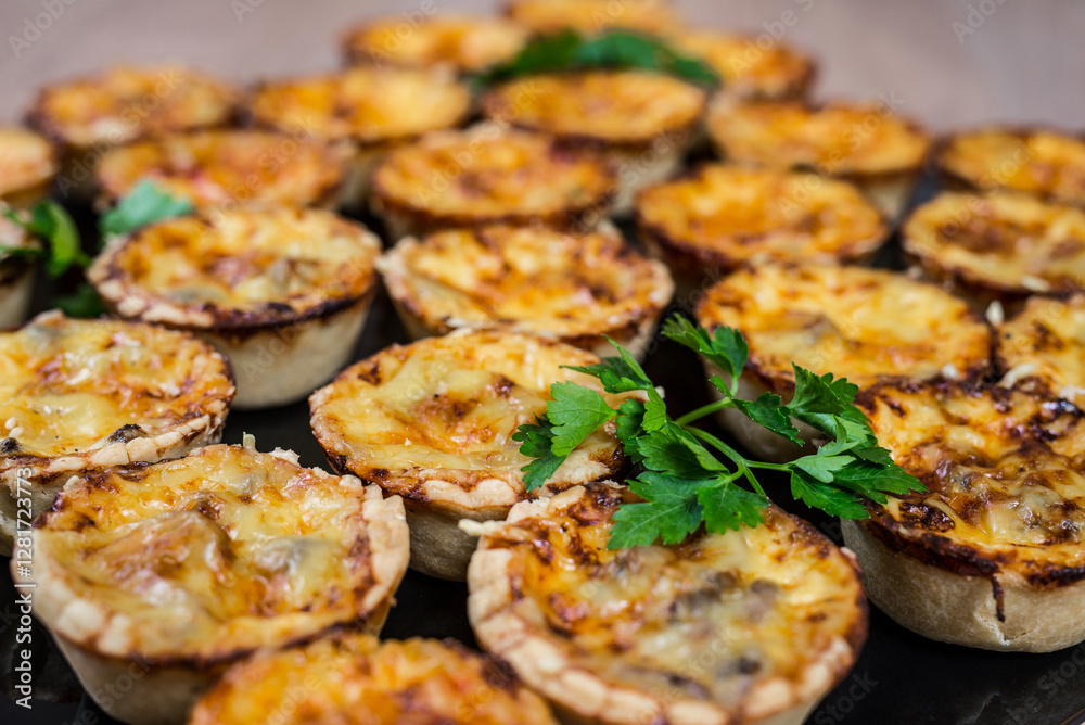 Assortment of savory mini tarts These tarts have a variety of toppings and are bite sized treats Assortment of savory mini tarts These tarts have a variety of toppings and are bite sized treats