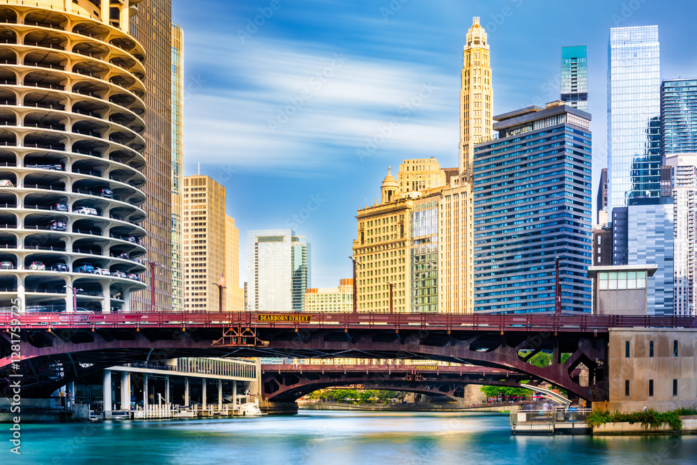Long exposure view of Chicago, Illinois skyline in front of the Dearborn street and State street bridges. Chicago is the most populous city in the U.S. state of Illinois and in the Midwestern USA
