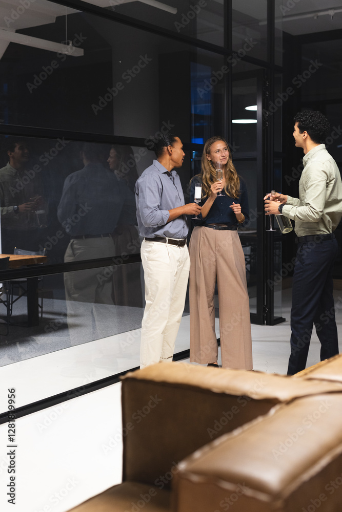 In office, diverse colleagues having drinks and conversation during evening gathering, copy space In office, diverse colleagues having drinks and conversation during evening gathering, copy space