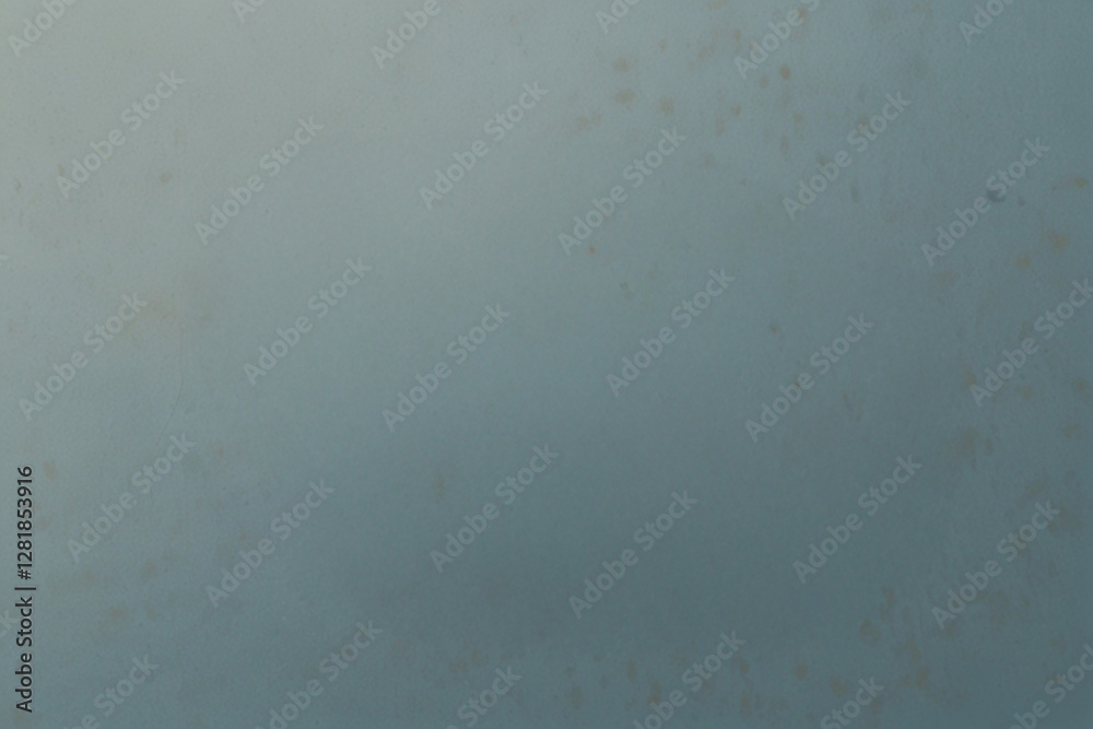 The image features a textured, solid-colored blue-gray surface with subtle variations in tone and an abstract, minimalistic aesthetic. The image features a textured, solid-colored blue-gray surface with subtle variations in tone and an abstract, minimalistic aesthetic.