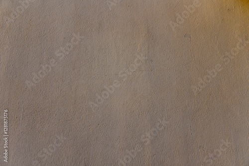 Unique texture of a soft surface highlighting subtle variations in color and pattern under warm lighting