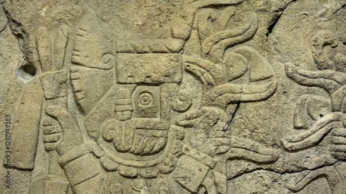 Ancient Olmec petroglyphs carved into stone, showcasing intricate symbols and sacred imagery from Mesoamerican civilization.