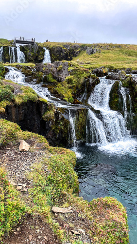 Scenic multi-tiered waterfall flowing through Iceland’s terrain
