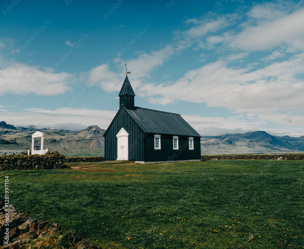 Búðakirkja, the historic black church of Búðir, stands against the vast Icelandic landscape in Snæfellsnes Peninsula, West Iceland. Búðakirkja, the historic black church of Búðir, stands against the vast Icelandic landscape in Snæfellsnes Peninsula, West Iceland.