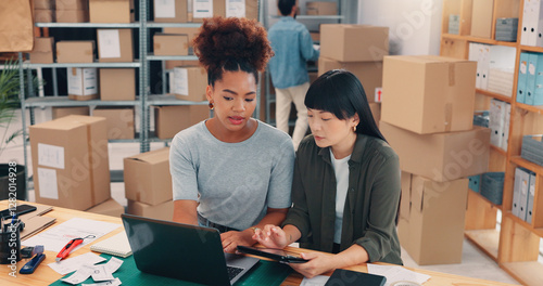Collaboration, planning and technology with people in distribution warehouse for logistics or supply chain. Laptop, shipping and tablet with team in office for order delivery or boxes or packages