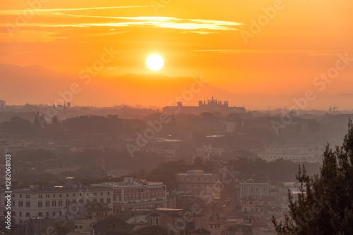 Vibrant sunrise over the city of Rome seen from the Terrazza del Gianicolo and Piazzale Giuseppe Garibaldi. Cityscape of the Capital of Italy