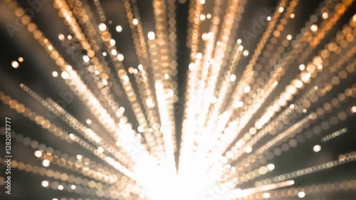 Bright orange sparks flying on black background