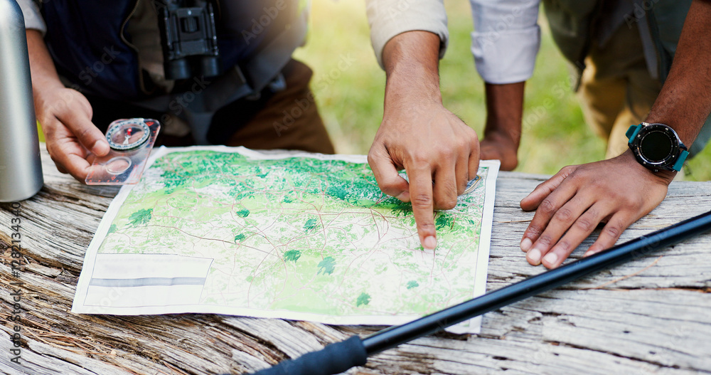 Obraz premium Hands, people and maps with compass for hiking of trekking direction, forest navigation and route. Lost friends, point and guide with woods location for travel journey, adventure path and destination