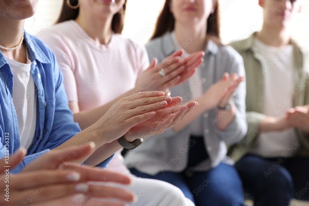 People applauding during meeting indoors, closeup view People applauding during meeting indoors, closeup view