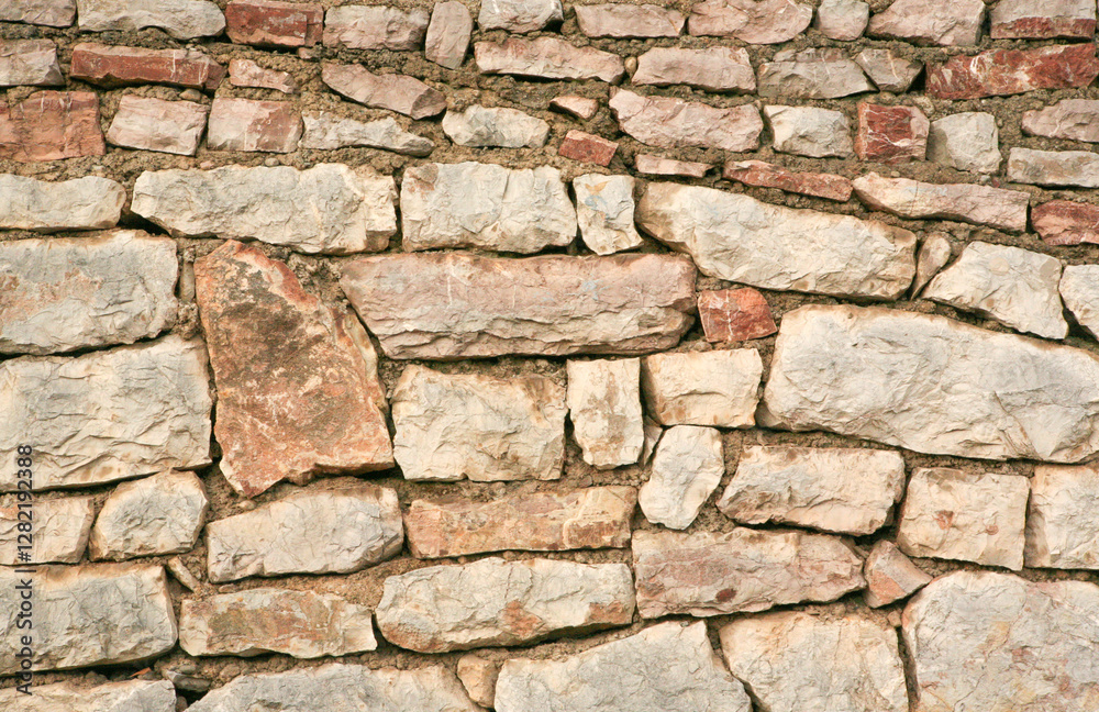 Background of a stone wall made of large stones without mortar, close-up. Stoney texture for publication, design, poster, post, screensaver, wallpaper, cover, website. High quality photo Background of a stone wall made of large stones without mortar, close-up. Stoney texture for publication, design, poster, post, screensaver, wallpaper, cover, website. High quality photo