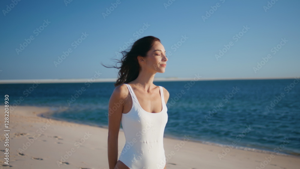 Carefree tourist strolling coastline relaxing under summer sunlight closeup. Carefree tourist strolling coastline relaxing under summer sunlight closeup.