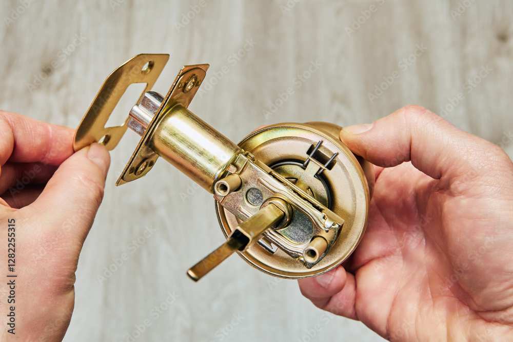 Brass doorknob being built piece by piece focusing on the spindle connection and latch. Brass doorknob being built piece by piece focusing on the spindle connection and latch.