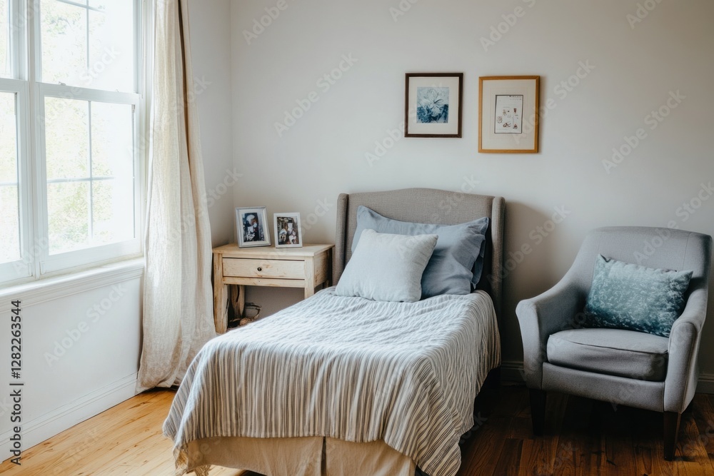 Fototapeta premium Bright bedroom with single bed, armchair, and natural light.