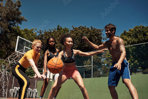 Fotografie Friends, basketball and playing defense on court, community and outdoor competition with players