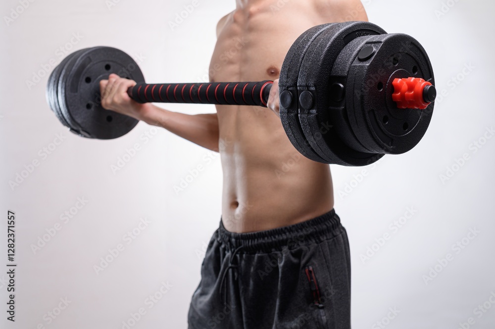 Obraz premium Person Lifting Dumbbell for Fitness and Strength Training Workout