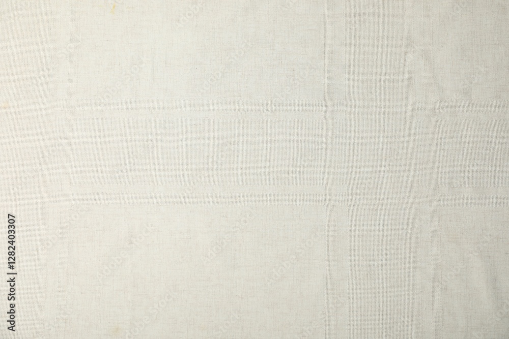 Fototapeta premium Texture of beige tablecloth as background, top view