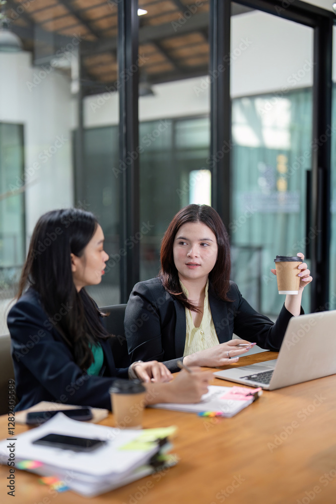 Professional women brainstorming project ideas and discussing strategies in a vibrant office environment. Professional women brainstorming project ideas and discussing strategies in a vibrant office environment.