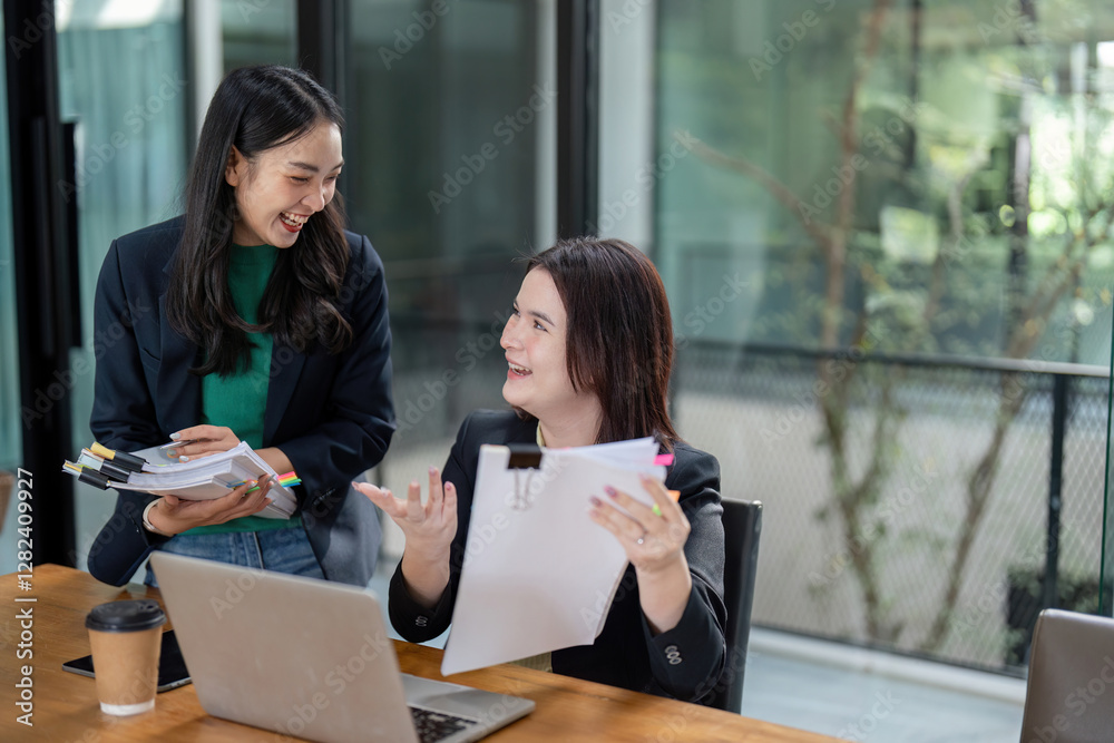 Diverse female team reviewing project progress and sharing insights in a modern collaborative workspace.