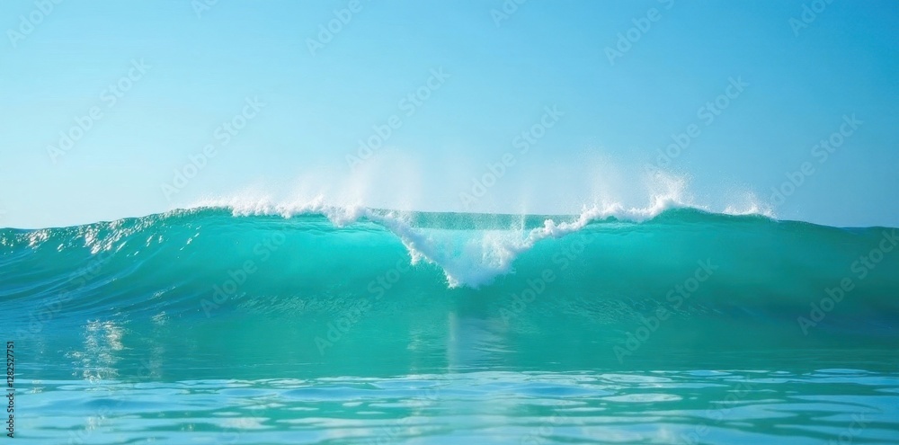 Fototapeta premium Ocean wave crests, turquoise water, clear sky, calm, foam
