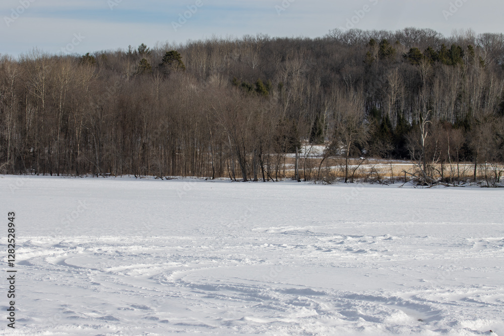 winter landscape with a snow-covered frozen lake winter landscape with a snow-covered frozen lake