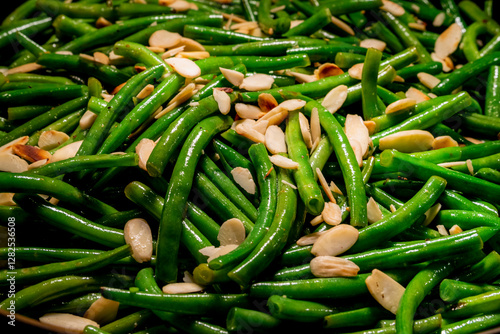 Close-up of cooked green beans with almond slices 