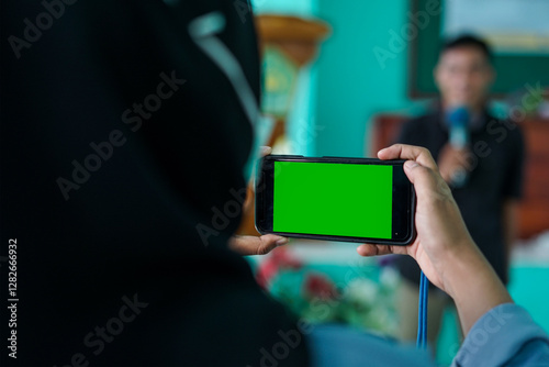 Gereen Screen Hand Phone on the stand taking photos