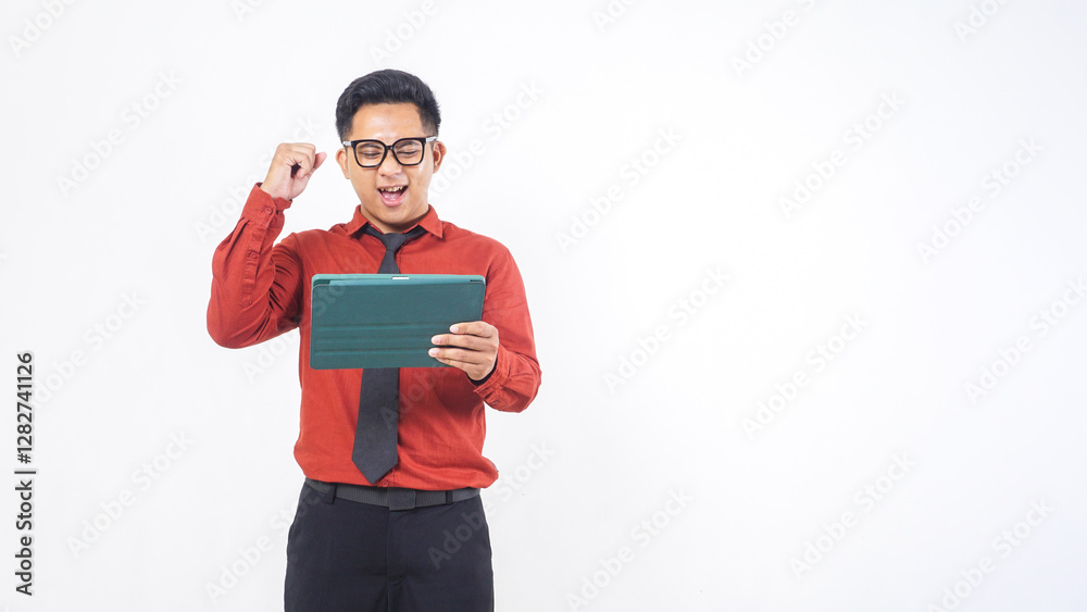 Excited Asian Male Office Worker Holding Digital Tablet While Celebrating Success Isolated on White Background Excited Asian Male Office Worker Holding Digital Tablet While Celebrating Success Isolated on White Background