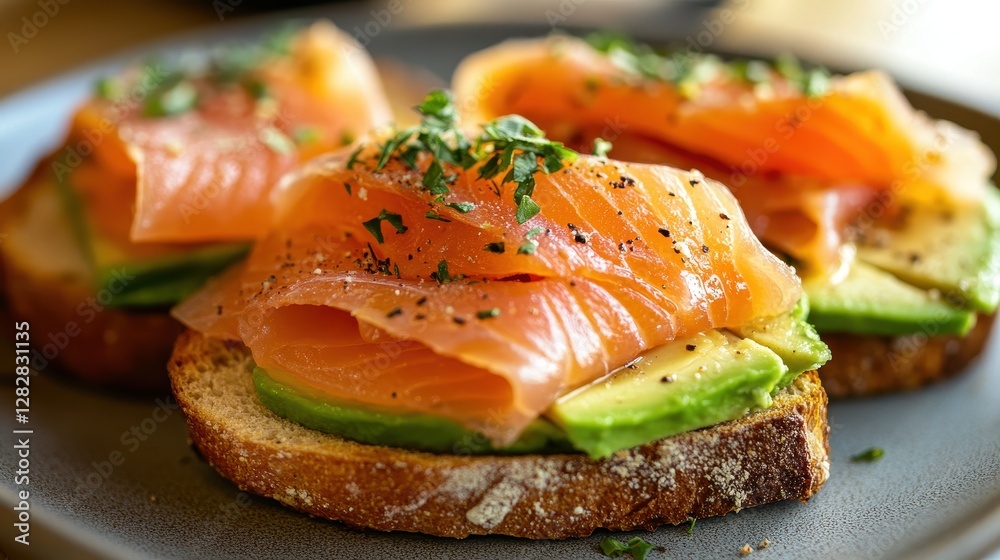 Golden slices of smoked salmon, nestled between toasted rustic bread, were adorned with creamy avocado slices and fragrant herbs, a symphony of flavors and textures. Golden slices of smoked salmon, nestled between toasted rustic bread, were adorned with creamy avocado slices and fragrant herbs, a symphony of flavors and textures.