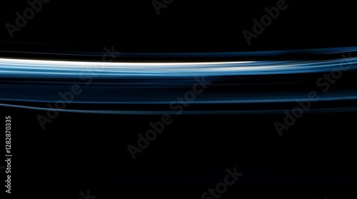 Abstract Blue Light Streaks on Black Background: A Dynamic Motion Blur Photography