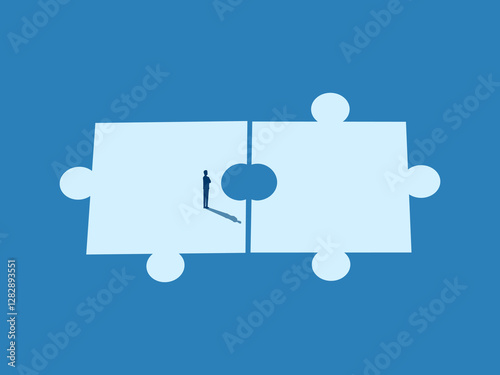 Businessman piecing together an imperfect jigsaw puzzle