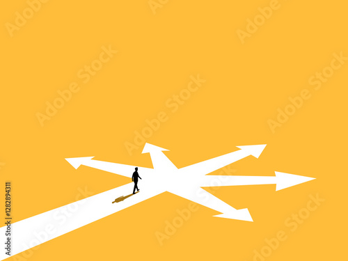 Businessman walking at a crossroads following the arrows