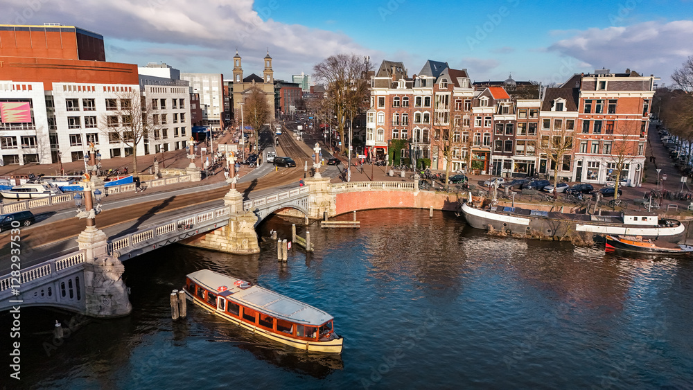 Amsterdam city center aerial view from above, historic buildings, dutch architecture and canal with boats and bridge, Amsterdam drone cityscape, the Netherlands Amsterdam city center aerial view from above, historic buildings, dutch architecture and canal with boats and bridge, Amsterdam drone cityscape, the Netherlands