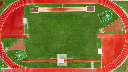 Running track aerial drone view from above, athletic stadium with track lines bird’s view, sport and fitness infrastructure in the Netherlands