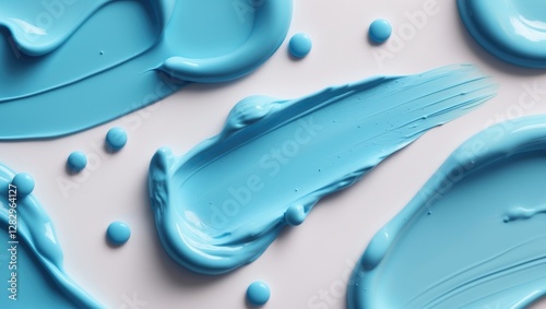 Abstract blue paint strokes and dots on a white background creating a textured artistic surface for design purposes